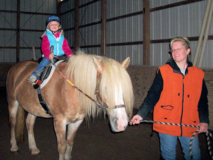 Child riding Lu-Rain